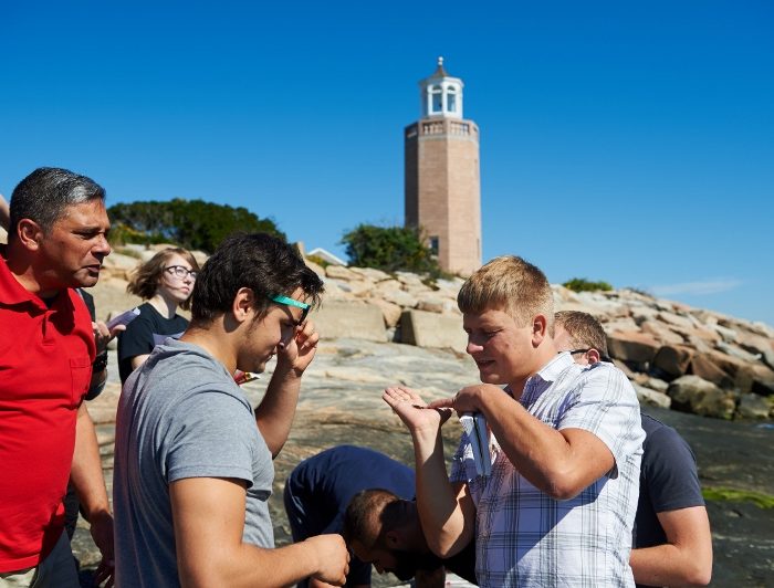 Hannes Baumann leads a marine sciences class outdoors at the Avery Point campus on Sept. 23, 2015